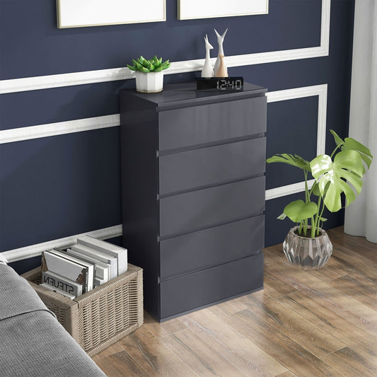 Grey high gloss chest of drawers in a bedroom setting next to a bed
