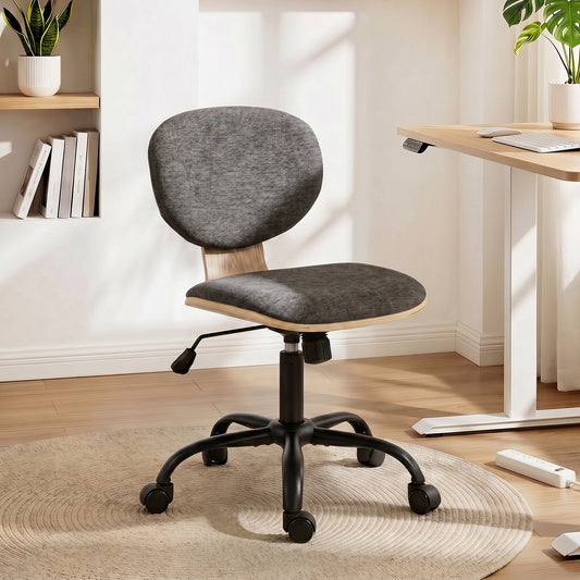 The office chair is placed on a rug next to a desk in a modern room