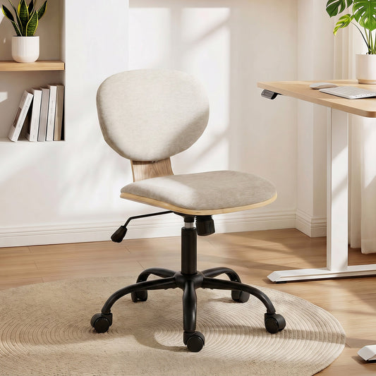 The light grey office chair in a modern room next to a desk on a round rug