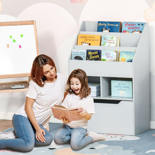A mother and child reading a book next to the kids storage unit in a playroom