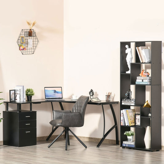 The office desk in a home office setting with a laptop and chair