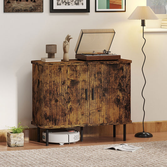 The storage cabinet placed in a living room with a record player on top and a robot vacuum below