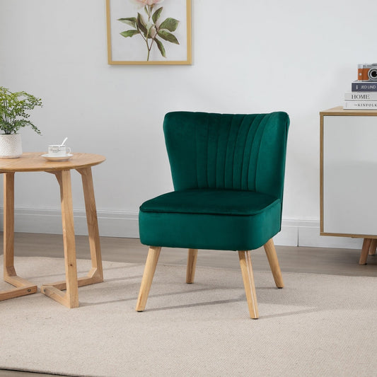 Green velvet armchair in a bright living room setting next to a small round table