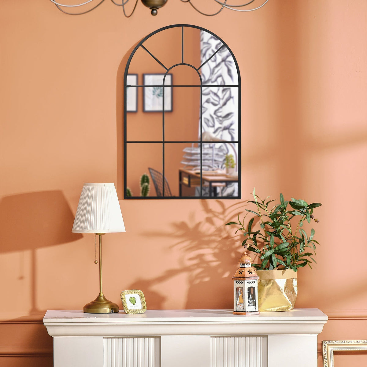 A close-up of the arched wall mirror reflecting a room interior