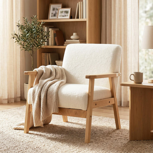 The accent chair styled in a cosy living room with a throw blanket draped over the seat