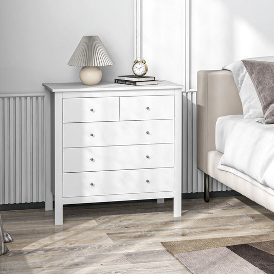 The white storage cabinet with five drawers placed next to a bed in a bedroom setting