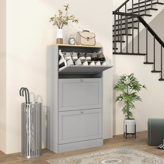 The shoe storage cabinet placed in a hallway with shoes inside the open top compartment
