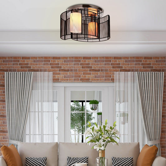 The ceiling light mounted in a living room above a sofa with a brick wall background