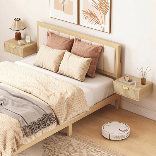 Two oak floating bedside tables mounted on a wall either side of a bed