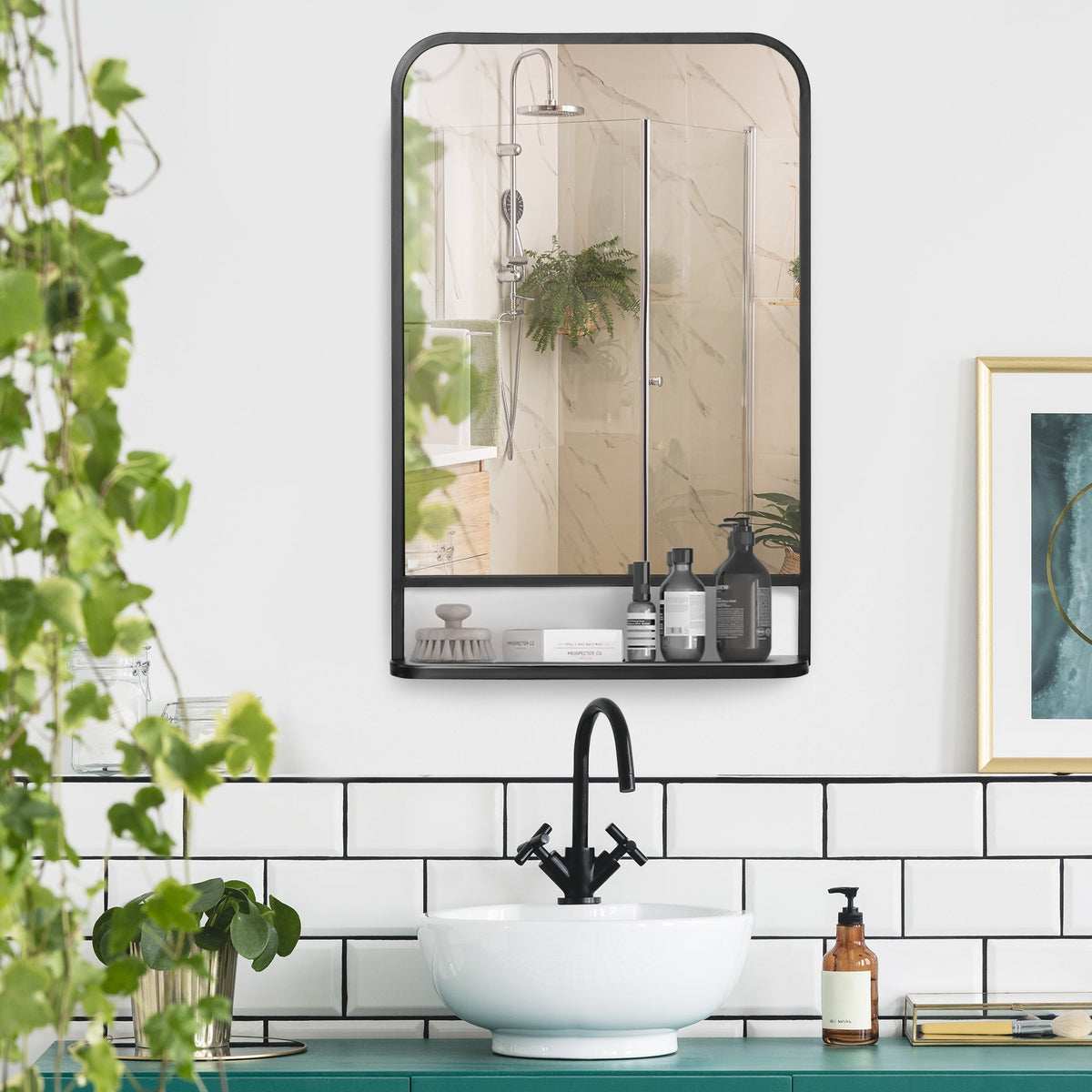 The wall mirror with storage shelf in a bathroom setting above a sink