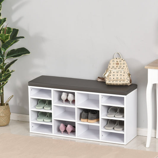 The white shoe storage bench with a dark cushion top is filled with various shoes and a backpack on top