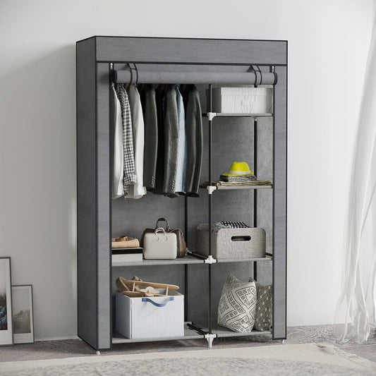 The fabric wardrobe is shown with clothes hanging on the rail and items stored on the shelves