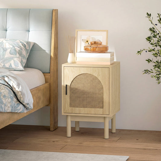 The rattan bedside table next to a bed in a bedroom setting