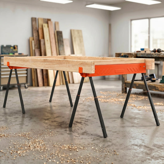 Two orange folding trestles supporting a wooden frame in a workshop setting