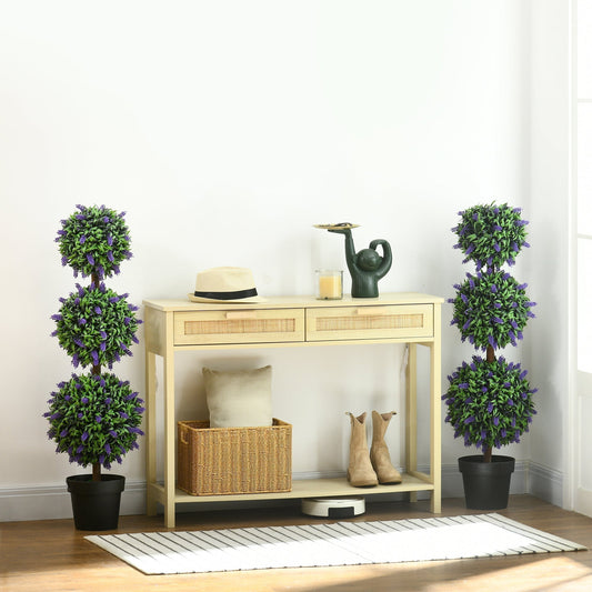 Two artificial lavender ball trees flanking a console table with decor