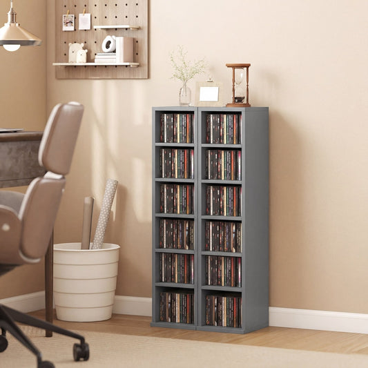 The CD media display shelf unit tower rack filled with CDs in a home office setting
