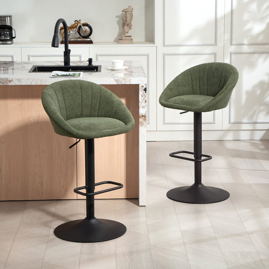 Two dark green tub bar stools in a modern kitchen setting