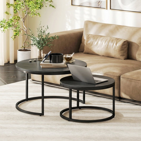 Two round wood-effect coffee tables in a modern living room setting