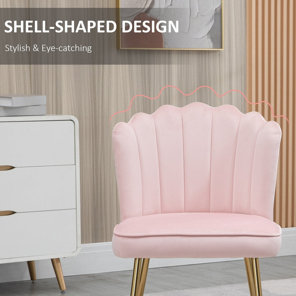Close-up of the shell-shaped backrest on the pink velvet dining chair