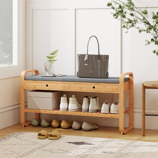 The shoe storage bench in a hallway with shoes and a bag on it