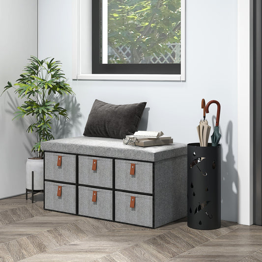 The shoe storage bench placed in a bright hallway next to a plant and umbrella stand
