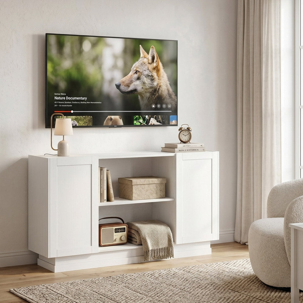 White storage cabinet used as a TV stand in a living room, with a television and decorative items