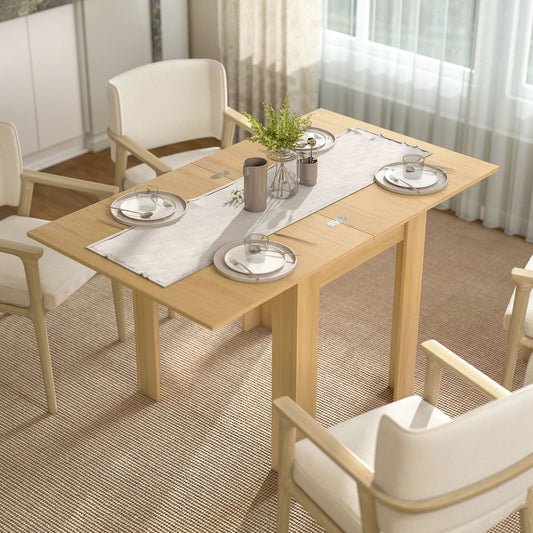 Small dining table set up for four people in a bright dining room