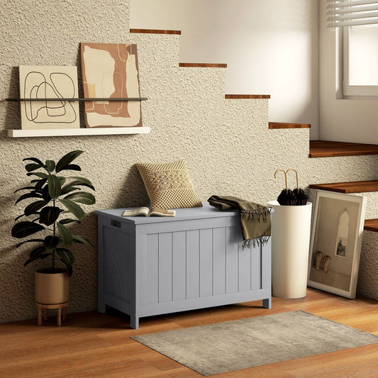 A grey wooden toy box used for storage in a modern living room setting