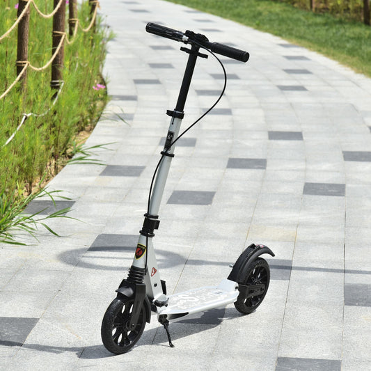 The folding scooter standing on a paved path in a park setting
