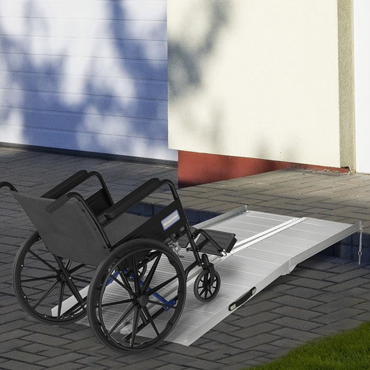 The portable threshold ramp in use with a wheelchair approaching a step