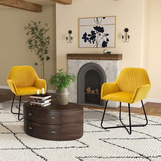 Two yellow accent chairs in a living room setting with a fireplace and rug