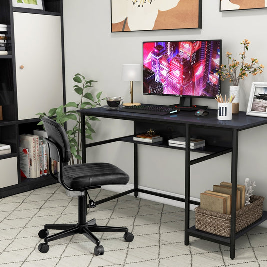 The black computer desk is set up in a home office with a chair and computer