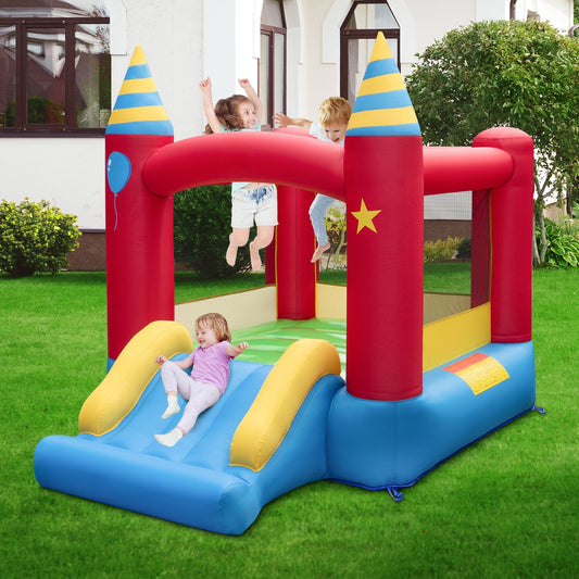 The bouncy castle is set up in a garden with children jumping and sliding