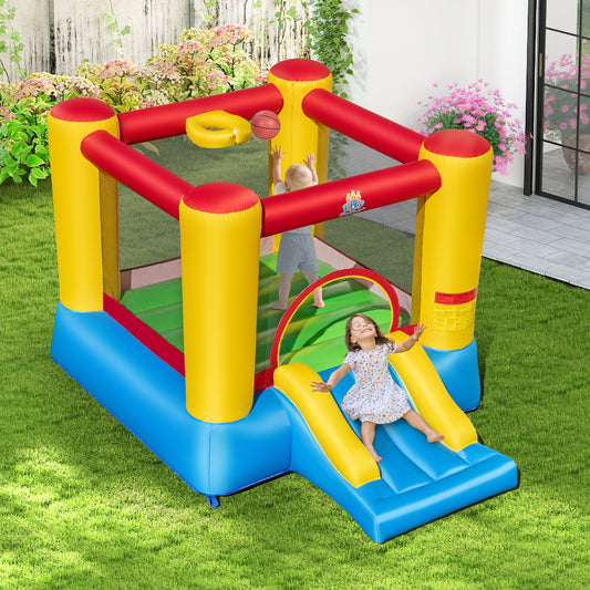Children playing on the bouncy castle slide in a garden setting