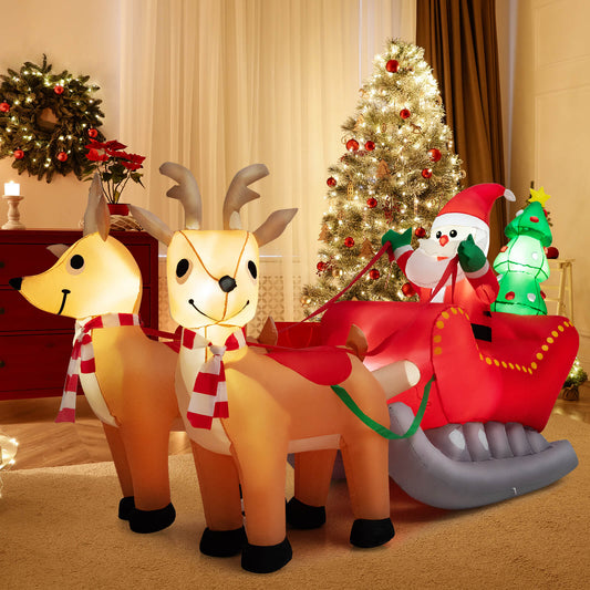The inflatable Santa and reindeer set up indoors in a living room with a Christmas tree