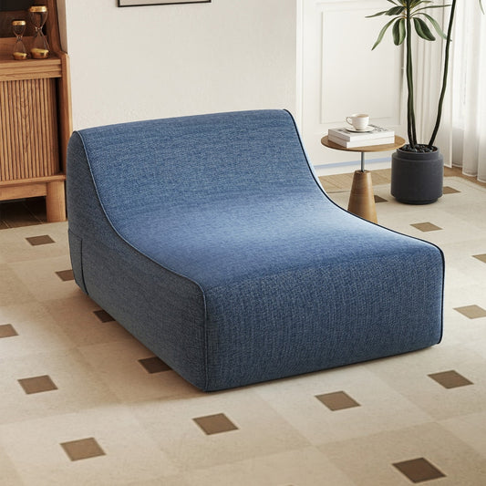 Blue inflatable sofa in a bright living room with a plant and a side table