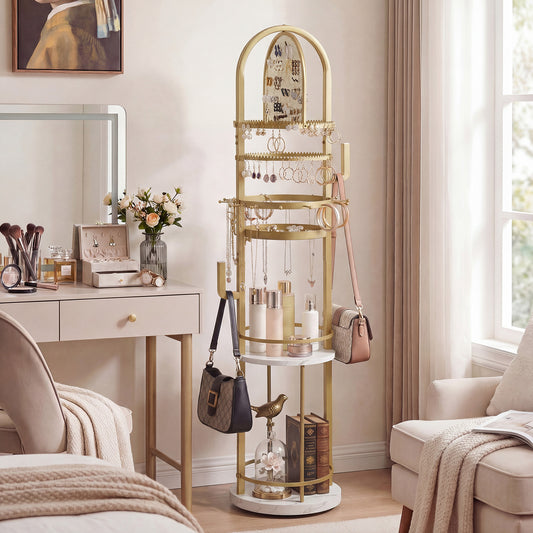 The jewelry storage rack in a bedroom setting next to a dressing table