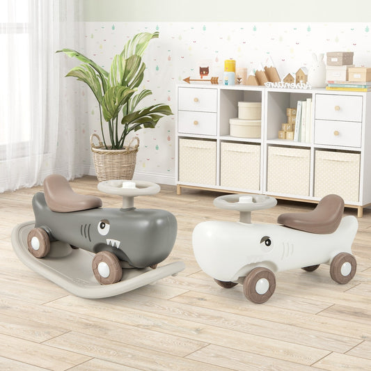 Two kids convertible rocking horse and sliding cars, one white and one grey, in a nursery room