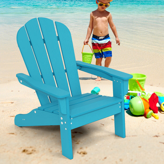 Turquoise kids lawn chair on a sandy beach with a child playing
