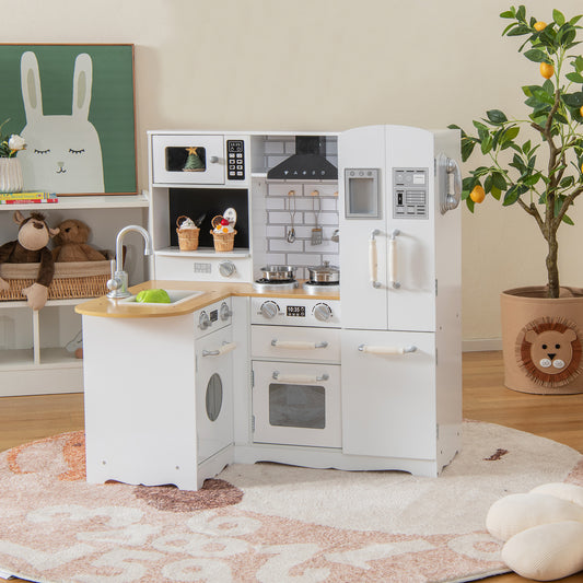 The white wooden play kitchen set is shown in a room with a bunny picture on the wall and a plant