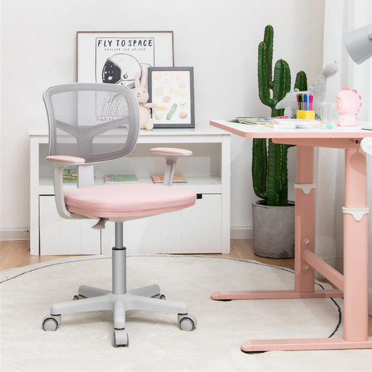 The kids chair placed in a bright bedroom next to a desk with toys and decor