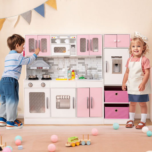 Children playing with the pink and white toy kitchen set, one boy and one girl