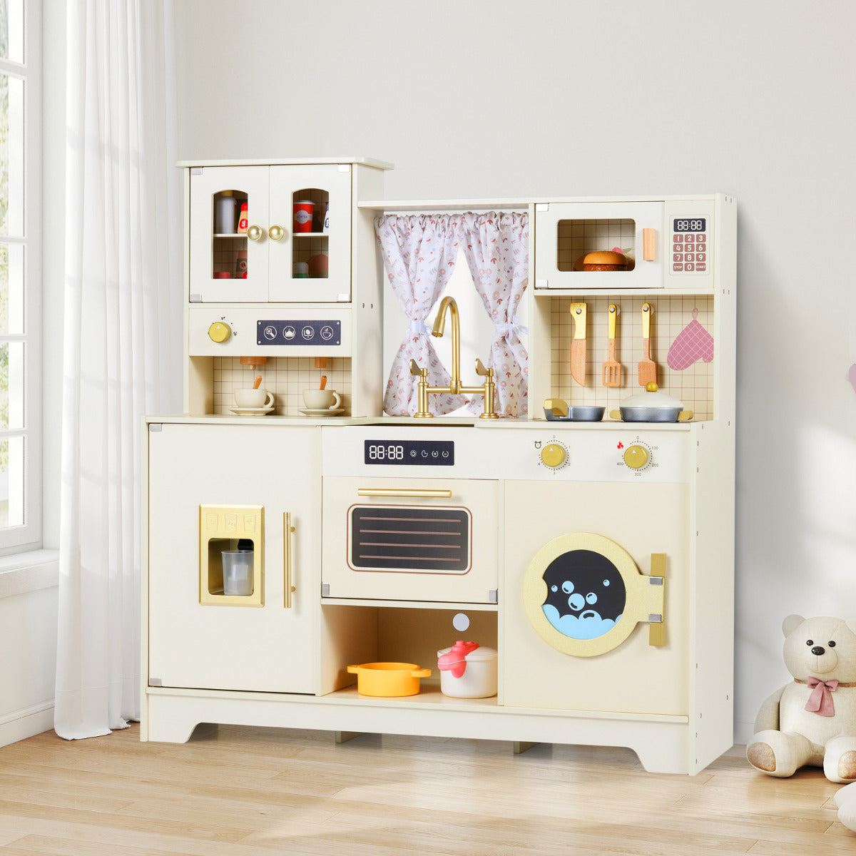 Beige toy kitchen playset with a teddy bear in a room