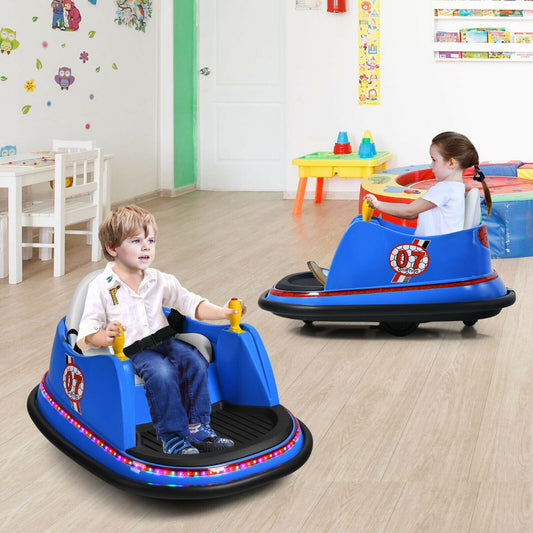 Two children enjoying the blue electric bumper cars in a playroom setting