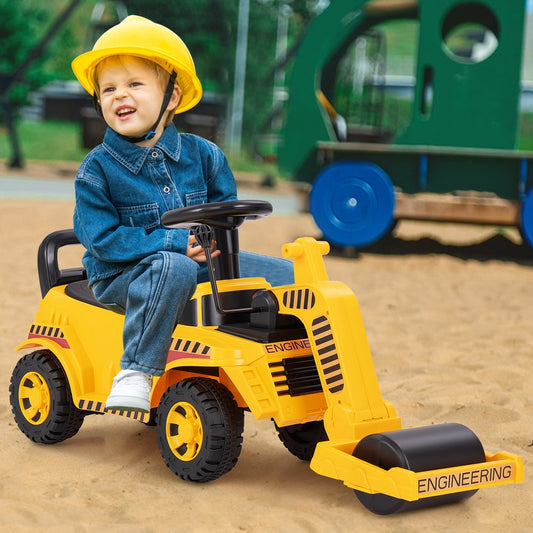 Young boy wearing a yellow hard hat riding the yellow road roller toy