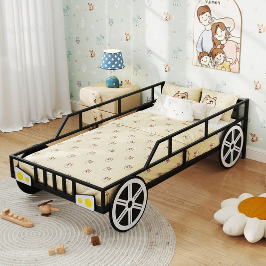 Black car-shaped bed frame with wheels in a child's bedroom with bedding