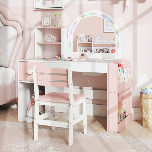The pink and white kids vanity table and chair set is shown in a child's bedroom setting
