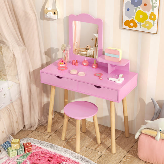 The light pink kids vanity table and stool set with accessories on top