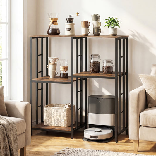 The baker's rack in a living room, styled with coffee making items and books
