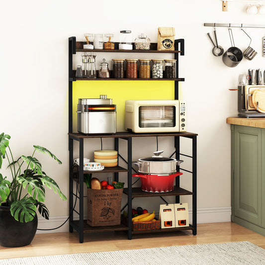The kitchen stand filled with appliances and food in a bright home kitchen